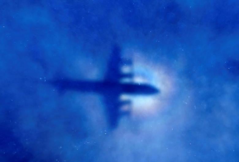 FILE PHOTO: The shadow of a Royal New Zealand Air Force (RNZAF) P3 Orion maritime search aircraft can be seen on low-level clouds as it flies over the southern Indian Ocean looking for missing Malaysian Airlines flight MH370 March 31, 2014. REUTERS/Rob Griffith/Pool/File photo